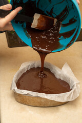 pour the brownie dough into the baking pan