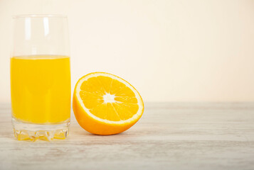 orange and natural orange juice on a white table background