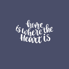 Naklejka na ściany i meble Inspirational quote Home is where heart is. Lettering phrase. Black ink. Vector illustration.