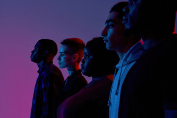 Friendly young multiracial people standing side by side