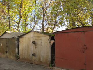 Fototapeta na wymiar Brick garages with metal gates of a garage cooperative