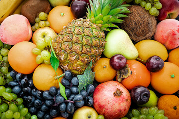 Naklejka na ściany i meble Various assorted juicy fruits. Fresh fruits colorful background.