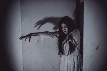 Portrait of asian woman make up ghost,Scary horror scene for background,Halloween festival...