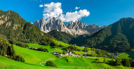 Famous best alpine place of the world, Santa Maddalena village with magical Dolomites mountains in...