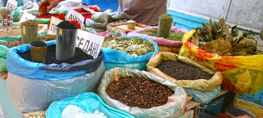 Osh, Kyrgyzstan - 10.09.2019: Local food and spices in Osh bazar, the main market in Bishkek. Photo with copy space