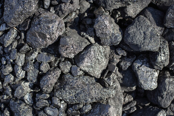 Large shiny lumps of coal. Mineral, mineral fuel for home stoves and boilers in a country house.