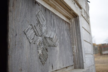 Wooden platform with accented cross made from matches. 