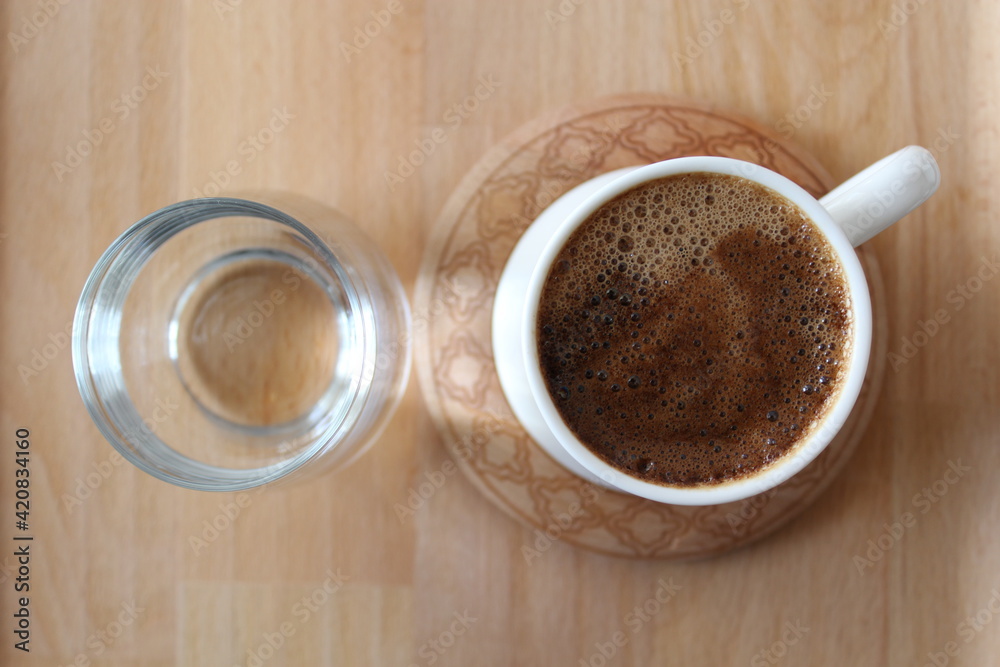 Wall mural three cups of turkish coffee on a wooden bamboo tray. mortar brown in white cups