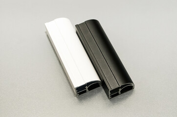White and black asymmetrical profile for sliding wardrobes.
