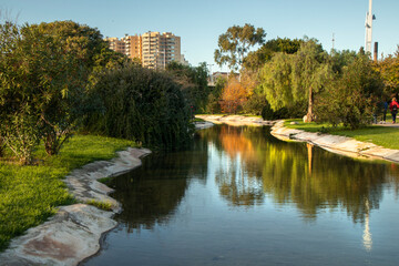 A beautiful woman relaxes in the green grass park