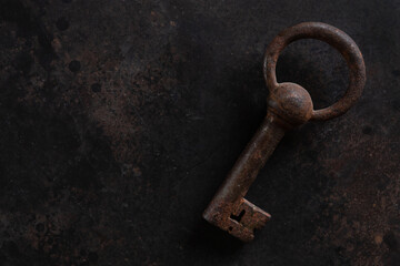  Antique key on the vintage background.