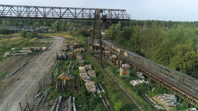 The woodworking plant is not far from the city in the forest.Aerial photography.Top view.Processing of the tree.Forest