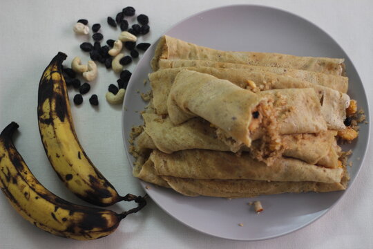 Home made Plantain Crepes or pancake with plantain coconut raisins mix in the middle.