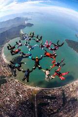 Skydiving big formation over the Brazilian beach