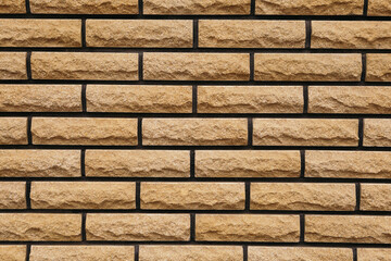 Close up bulding house made of brick wall fence exterior outside. Abstract background texture pattern. Image with free copy space for text message inscription
