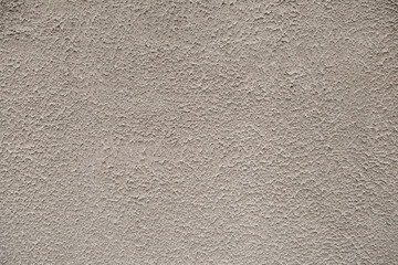 Close up painted golden concrete wall stucco texture background pattern, exterior outside house appartment living room decoration. Empty free copy space for text or message. 