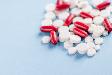 Collection of medicine pills on table, selective focus