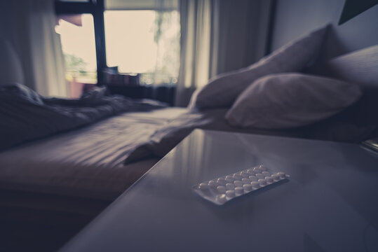 pills, pills on the bedside table, blurred background, blur