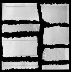 Torn papers on black
