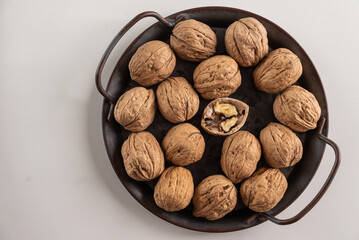 walnuts on the background of a metal round tray