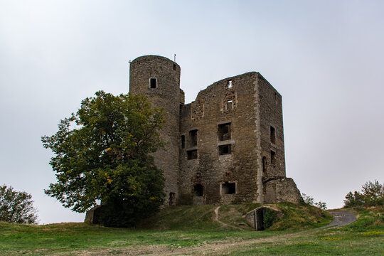 View of old ruin Arnstein castle with greenery under a cloudy sky in Saxony-Anhalt, Germany