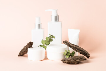 Skincare product with natural leaves and tree bark.