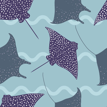 Seamless pattern of stingrays on blue watery background in flat style