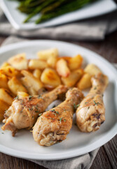 Roast chicken with potatoes. High quality photo.