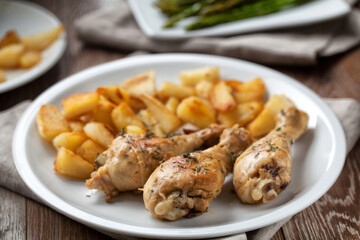Roast chicken with potatoes. High quality photo.