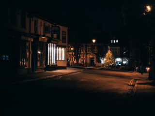 Dark moody village road at night