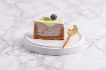 Modern cheesecake with blueberry jam and panna cotta
