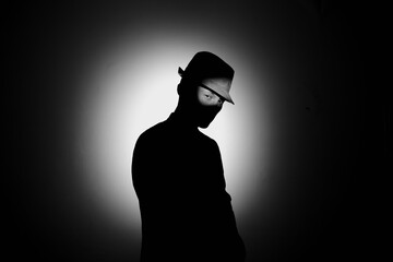 silhouette of a man in the dark.