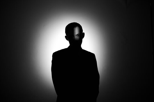 silhouette of a man in the dark.