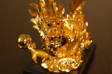 Close-up dragon figurine. Symbol of good luck and wealth.