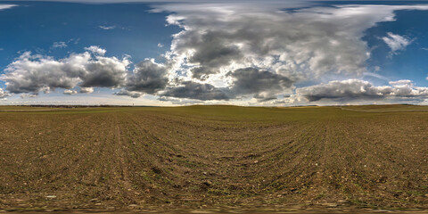 Fototapeta premium full seamless spherical hdri panorama 360 degrees angle view among farm fields in spring day awesome clouds in equirectangular projection, ready for VR AR virtual reality content