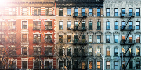 Sunlight shining on old apartment buildings on Eldridge street in the Lower East Side neighborhood of Manhattan in New York City - background texture