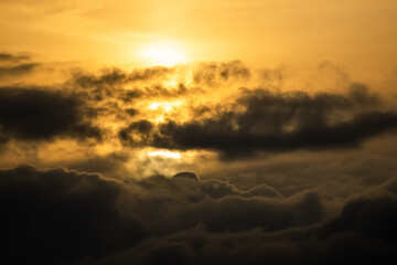 Fototapeta na wymiar dramatic sun scene behind clouds