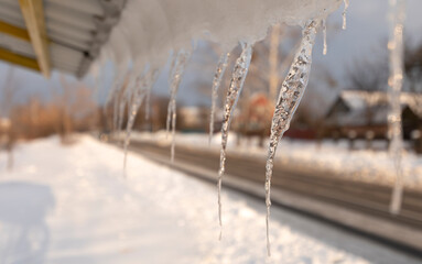 Warming in winter, icicles hanging from the roof.