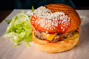 western style bacon burger with onion rings and bbq sauce