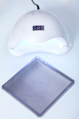 closeup of uv light dryer for nail manicure in manicure studio