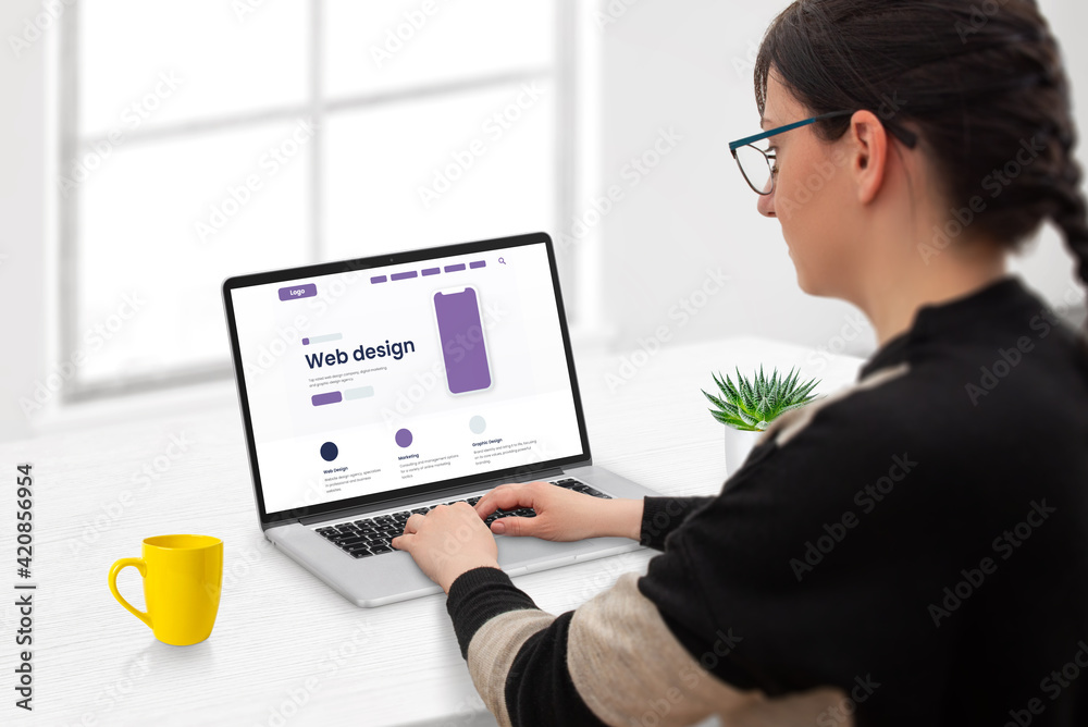 Poster website development concept. woman designs a website layout. modern flat webpage design