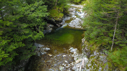 Photo above Latorita's Gorges. The mountain river formes a narrow canyon as it flows through large...