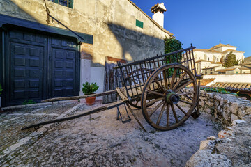 Fototapeta premium Old wooden cart drawn by animals for field work in ancient times. Chinchon, Madrid.