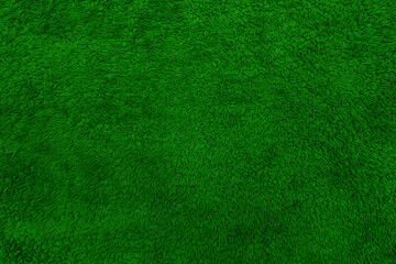 Terry towel texture. Soft fabric background. Green towel.