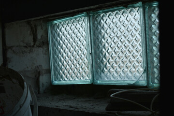 Close-up of a window in a barn and light.