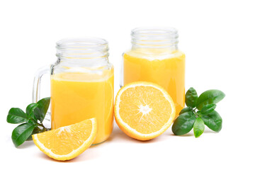 Orange juice and green leaves isolated on a white background.A glass of orange juice and orange fruit. Healthy food. Vegan food. Diet and proper nutrition. Copy space. Place for text.