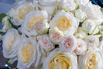 Obraz na płótnie Canvas Wedding bouquet of orange and white roses, waxflower and eucalyptus. Background