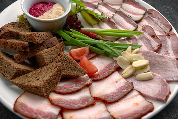 Bacon with garlic, onion and black bread
