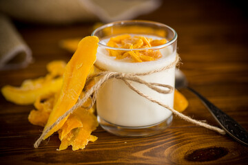 homemade sweet yogurt in a glass with mango