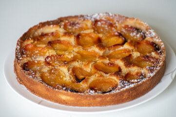 Fresh baked French pie with ripe plums